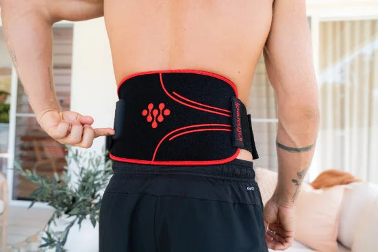 Man wearing an Infraredi body wrap across his lower back.