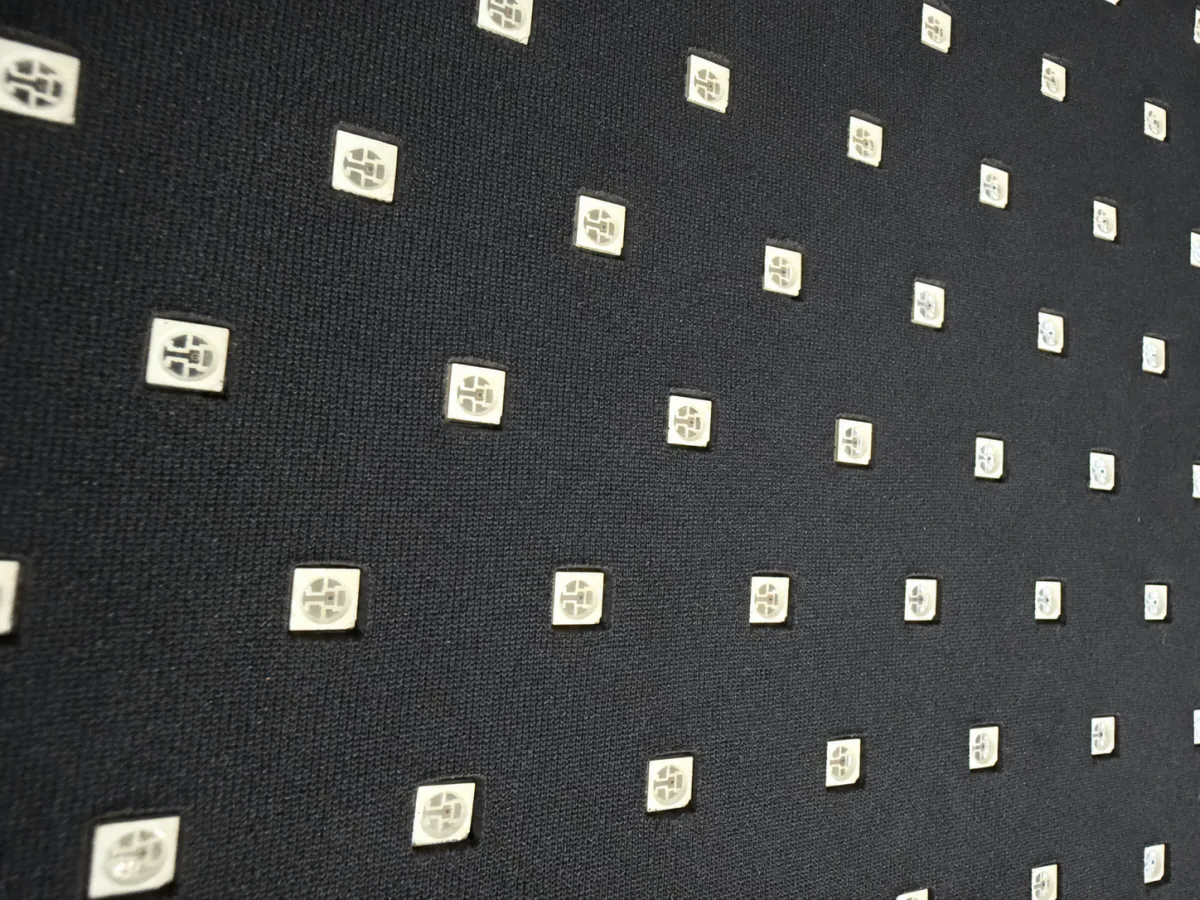 Close-up of the Infraredi wrap's black skin-facing fabric with rows of embedded LEDs